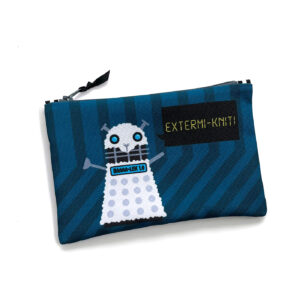 A blue zippered pouch with a cartoon character resembling a Dalek from "Doctor Who," but with a sheep's head. The character's chest plate reads "BAAA-LEK 10," and it has a speech bubble that says "EXTERMI-KNIT!".