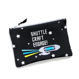 A black zippered pouch with a space shuttle graphic and the words "SHUTTLE CRAFT ENGAGE!" surrounded by white stars.